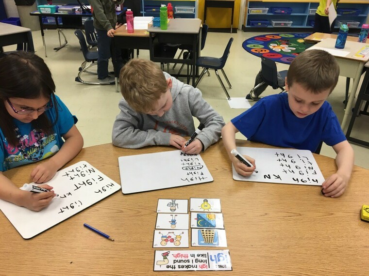 students doing school work at a table